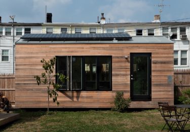 Minim House has a 960 watt solar array on the roof. A battery storage systems allows the house to be completely off grid when needed. The house runs primarily 12 volt appliances (LED lights, 12v marine refrigerator, water pump, etc), but also has an Outback pure sine wave inverter to run all 120v appliances.