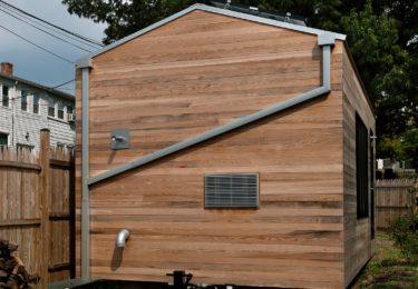 Minim House features off grid rainwater collection system with seamless roof gutters. On board and under trailer tanks may store up to 290 gallons of water. A through-the-wall a/c unit on the back eliminates any unsightly HVAC equipment- only the vent plate is visible.